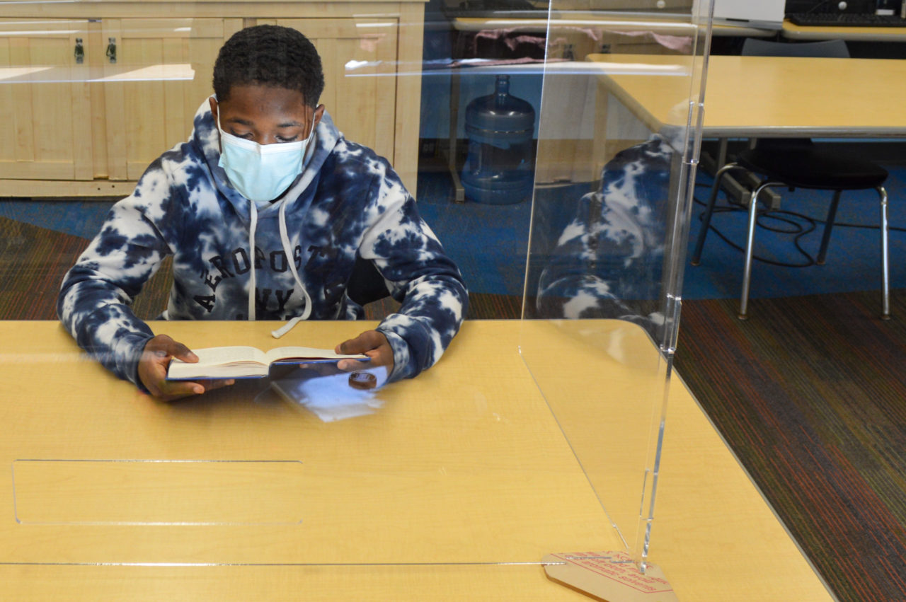 Demari reading a book