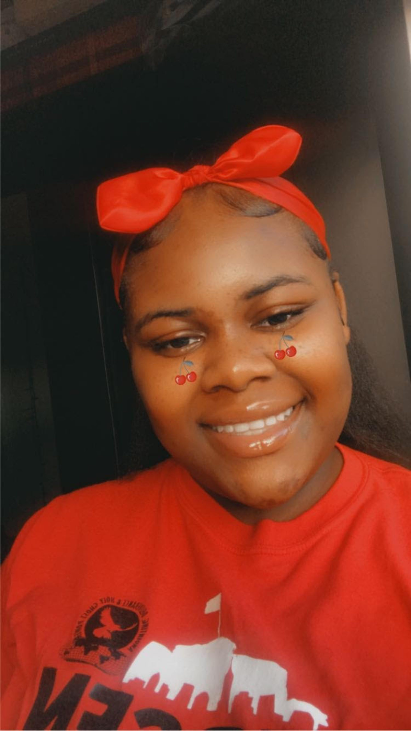 Brigina smiling and wearing a bow