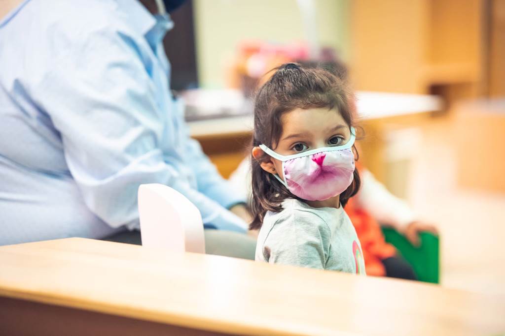 A girl wearing a mask