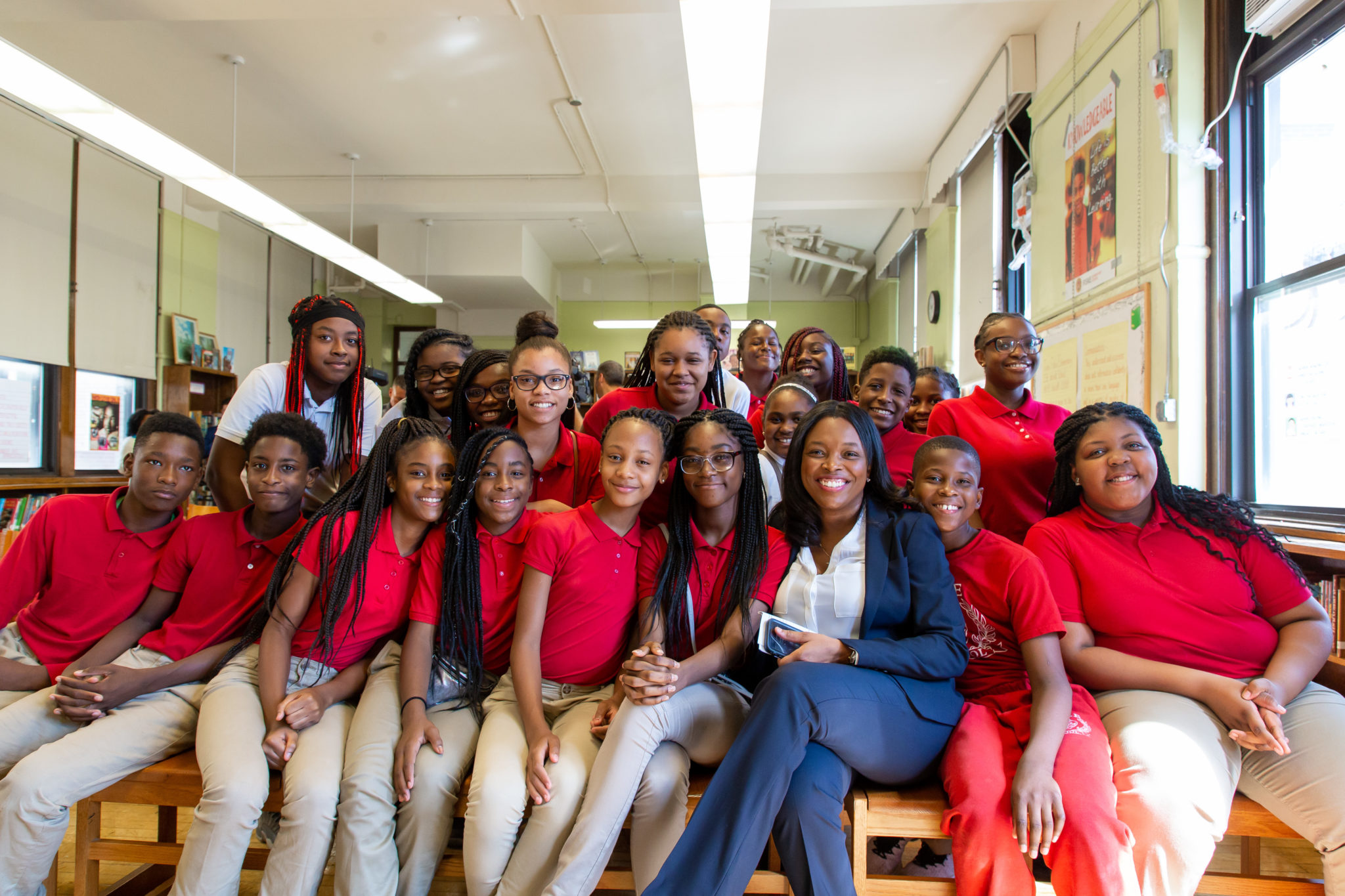 Janice sitting with a class of students