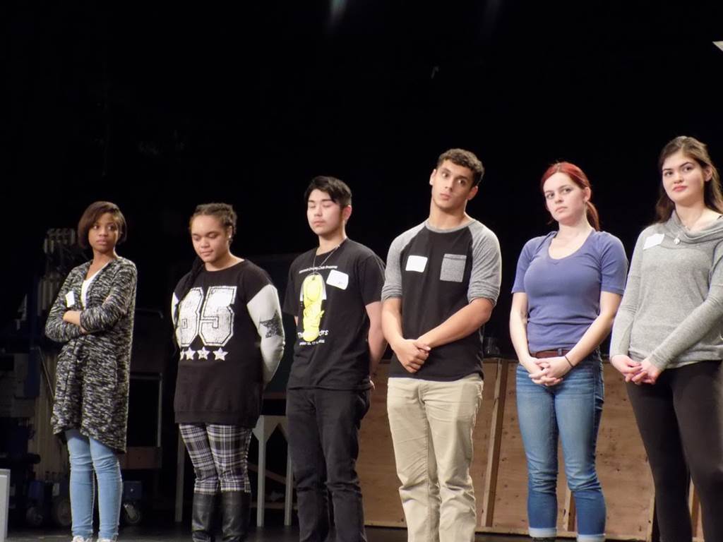 Six students preparing for a musical piece