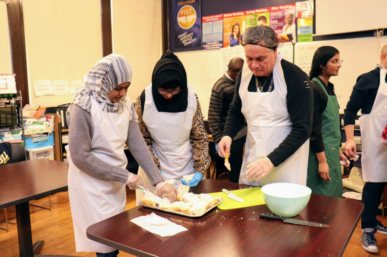 FACE Manager Les Kniskern cooks with parents and diverse learners at Sullivan High School.